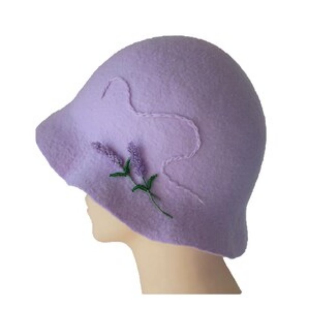 Very elegant, unique in its design, a ladies  hat made of natural soft felt .